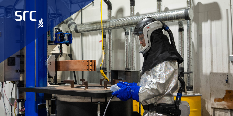 src employee operating a rare earth metal smelter