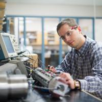 research engineer works on custom equipment