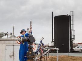 oil site technologist measures emissions