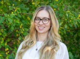Woman with glasses smiling